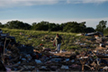 At least 27 dead after tornadoes and storms tear across central US